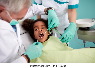 Black Kid In Chair On Dental Check Up