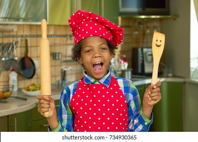 Black Kid With Cooking Utensils. Boy In The Kitchen. Basic Cooking Skills.