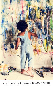 Black Kid Enjoying His Painting