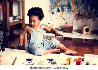 Black Kid Enjoying His Painting