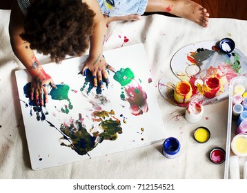 Black Kid Enjoying His Painting