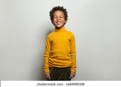 Black Kid Laughing. Happy Little Boy On White Background