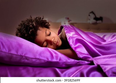 Black Kid Sleeping At Night. Midnight At Afro Boy's Bedroom. Darkness Brought Silence. End Of The Day.