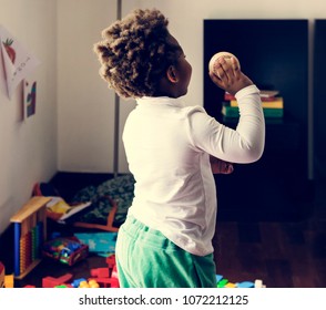 Black Kid Throwing Baseball Ball