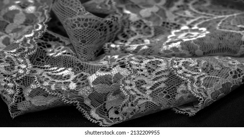 Black lace. Vintage floral background. Lace is an openwork fabric obtained by crossing the threads that form motives connected by the base