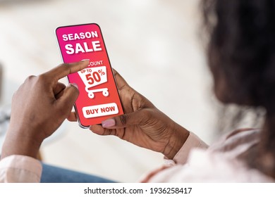 Black lady making online shopping, using mobile application