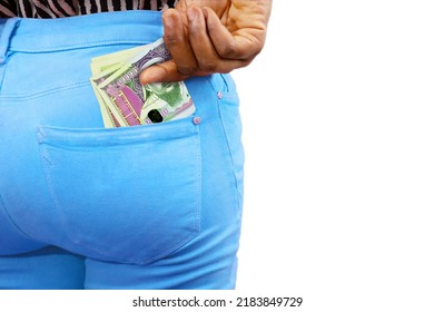 Black lady putting few Mongolian togrog notes into her back pocket. Removing money from pocket, hold money
