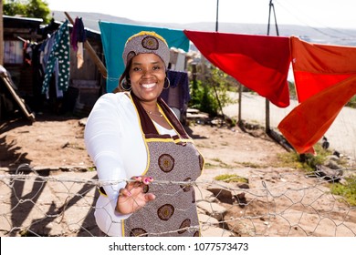 Black Lady Wearing Her Traditional Clothes While At Her Township House.