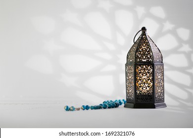 Black Lantern With Arabesque Shadow On Background.