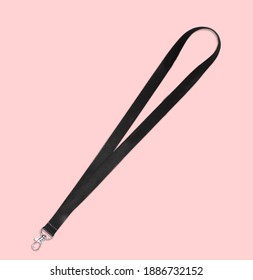 Black Lanyard Neck Strap  with Metal Lobster Clip . Isolated on pink background top view