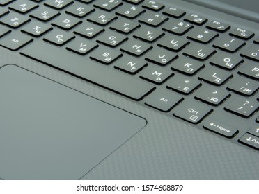 Black laptop keyboard and trackpad