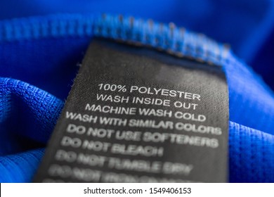 Black Laundry Care Washing Instructions Clothes Label On Blue Jersey Polyester Sport Shirt