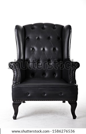 Black leather armchair isolated on white