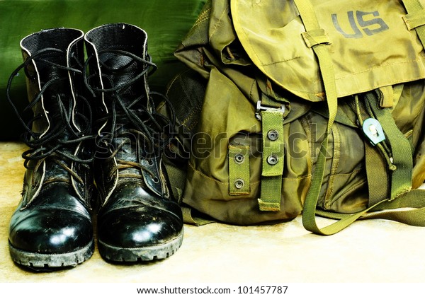 Black leather\
army boots and Army bag\
soldier