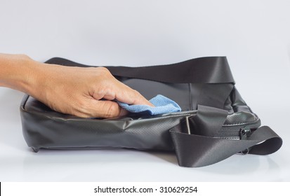 Black Leather Bag Cleaning With A Microfiber Cloth 