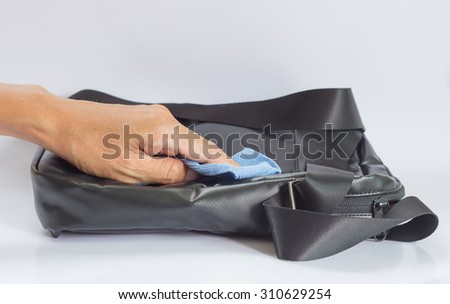 Black Leather Bag cleaning with a Microfiber Cloth 