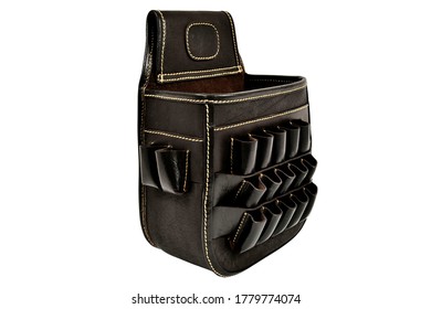 A black leather bullet bag is kept at one place showing its beauty, it has seventeen bullet shell slot and and big pocket in middle this bag used by hunters. - Powered by Shutterstock