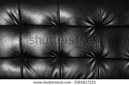 Black leather with buttons as background