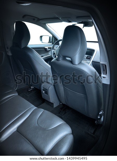 Black leather car interior. Rear seats interior of\
the car.