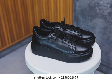 Black Leather Classic Sneakers With Laces. Casual Women's Style. Black Rubber Soles. Isolated Close-up On White Background. Right Side View. Fashion Shoes.