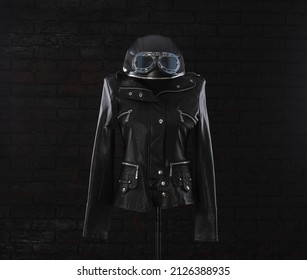 Black Leather Jacket With Studs On A Black Background