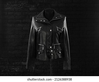 Black Leather Jacket With Studs On A Black Background