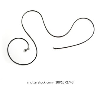 Black Leather Necklace Cord With Silver Clasp On White Background.