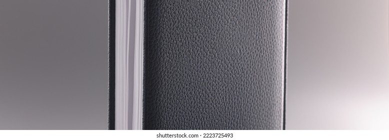 Black Leather Notebook Or Diary On Grey Background