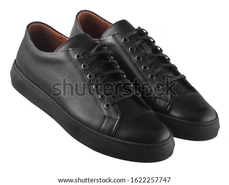 Black men’s leather sneakers isolated on white background