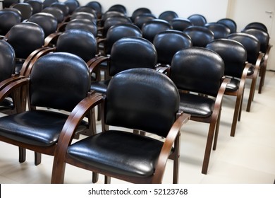 ?hairs of black leather standing in row for seminar or business activities