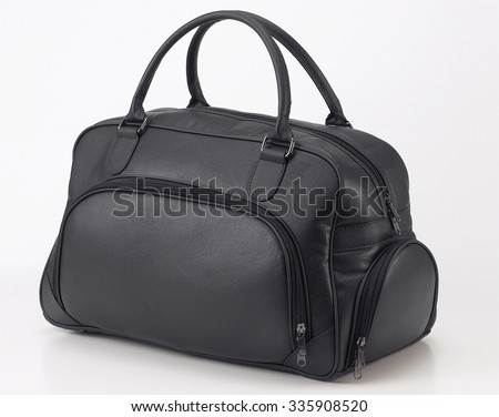 Black leather travel bag or duffel bag isolated on white background