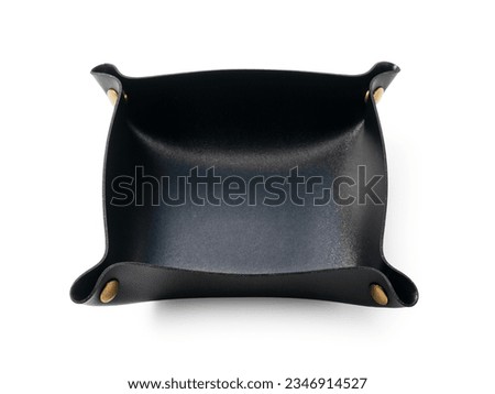 A black leather tray set against a white background.