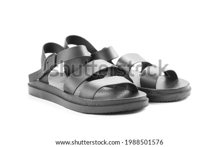 Black leather womens sandals. Close up. Isolated on a white background.