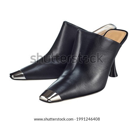 Black leather women's sandals with a closed top and an open back, with a heel, with a polished steel toe, isolated on a white background.