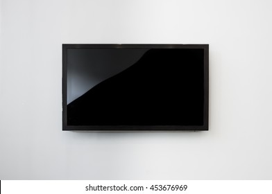 Black LED tv television screen mockup / mock up, blank on white wall background