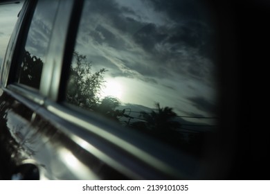 Black Light Film On The Car Glass, Reflection Of Sunset Sky At Dusk, Blur Photo