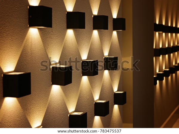 black light in the form of\
a cube on the wall, perspective, yellow light, a graphic pattern of\
light.\
