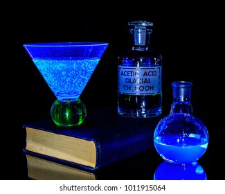 Black light producing colored solutions.
