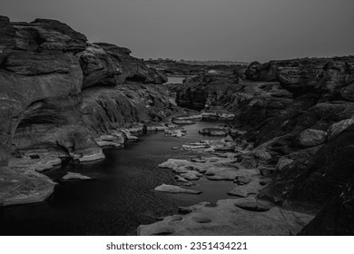 Black light and shadow at the source of the river's rocks