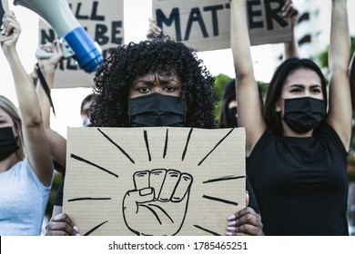 Black lives matter activist movement protesting against racism and fighting for equality - Demonstrators from different cultures and race protest on street for justice and equal rights