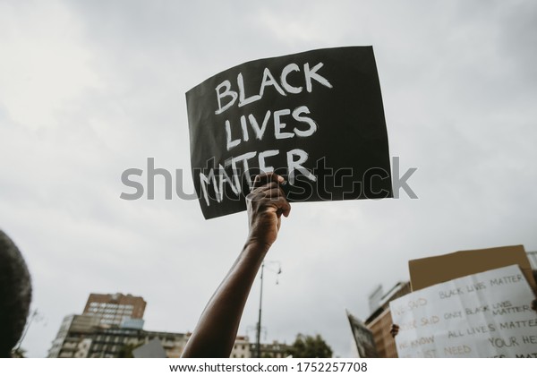  Black lives matter movement protesting in\
Milan, claiming for antiracism and equal human rights holding\
\