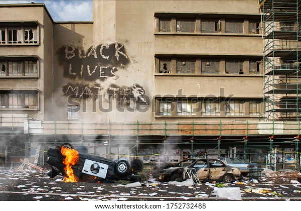 Black Lives Matter protest riot vandalism,\
looting aftermath concept, flaming police car smashed, overturned\
with black lives matter text slogan message on building. Excessive\
force, police brutality