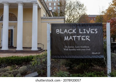 Black lives matter sign with scripture from bible in front of church with white pillars in Washington DC, USA