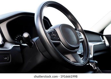 Black luxury modern car Interior. Steering wheel, shift lever and dashboard. Detail of modern car interior. Automatic gear stick. Part of leather seats with stitching in expensive car - Shutterstock ID 1916661998