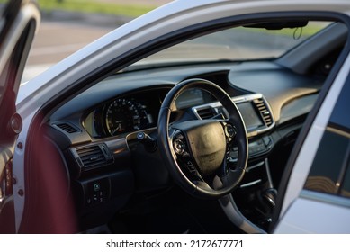 Black Luxury Modern Car Interior. Steering Wheel, Shift Lever, Speedometer, Display, Gearbox Handle, And Multimedia Dashboard. Detail Of Car Interior Inside. Automatic Gear Stick.