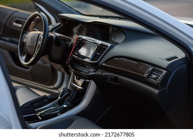 Black Luxury Modern Car Interior. Steering Wheel, Shift Lever, Speedometer, Display, Gearbox Handle, And Multimedia Dashboard. Detail Of Car Interior Inside. Automatic Gear Stick.