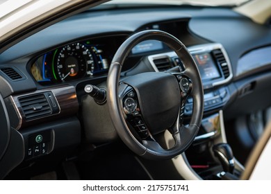 Black Luxury Modern Car Interior. Steering Wheel, Shift Lever, Speedometer, Display, Gearbox Handle, And Multimedia Dashboard. Detail Of Car Interior Inside. Automatic Gear Stick.