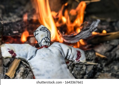 Black Magic Doll Sleeping In The Darkness And Bonfire In The Background  