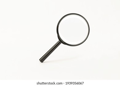 black magnifying glass on white background