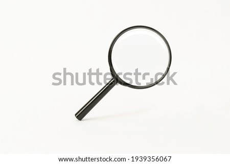 black magnifying glass on white background